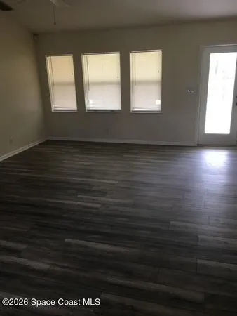 a bathroom with a granite countertop toilet a sink and a bathtub