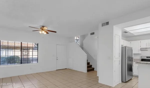 a view of empty room with windows