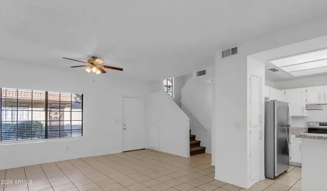 a view of empty room with windows