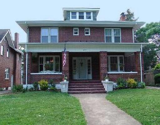 2114 Avenel Avenue Southwest Roanoke, VA 24015 - Photo 1 of 1 a view of brick house with large windows and a yard