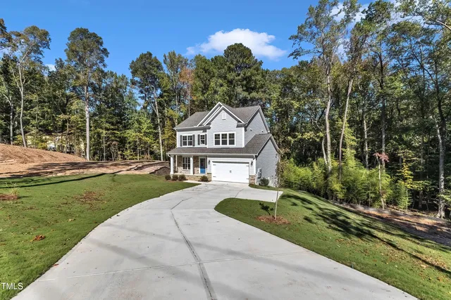 an empty room with wooden floor and window