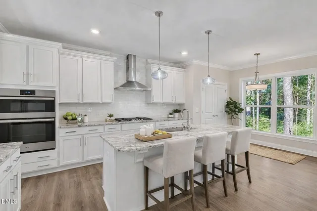 a bathroom with a double vanity sink toilet and a mirror
