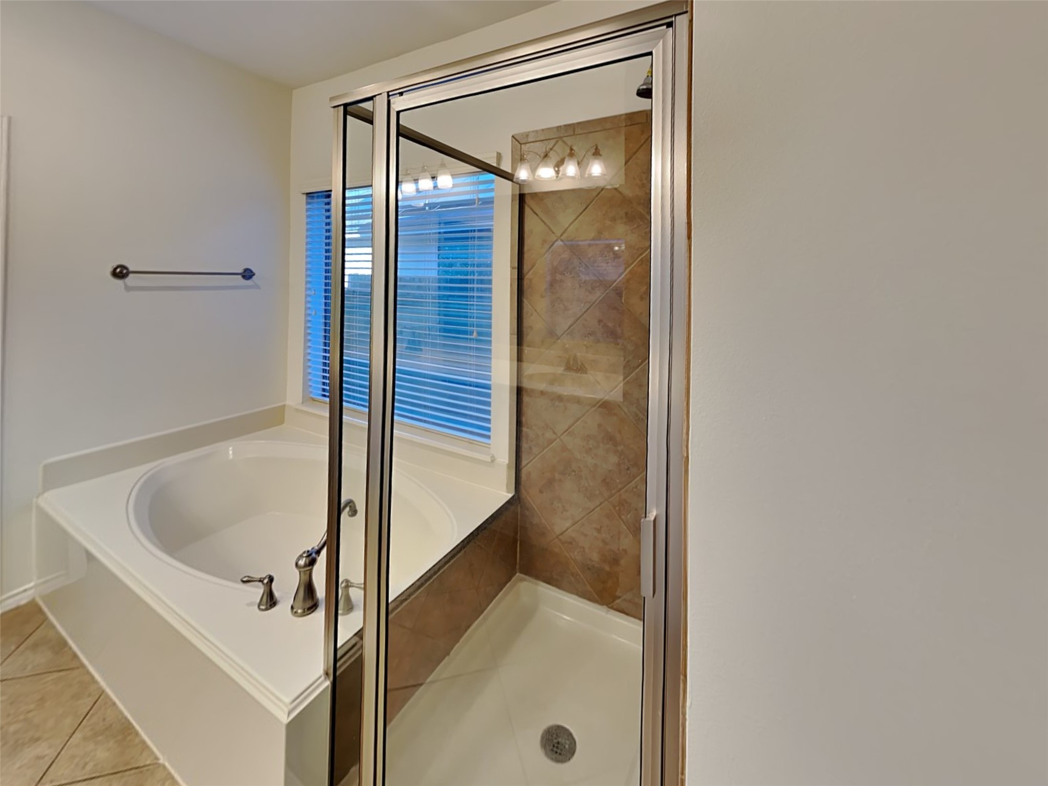 1323 Laura Hills Lane Spring, TX 77386 - Photo 12 of 22 a bathroom with a tub and shower