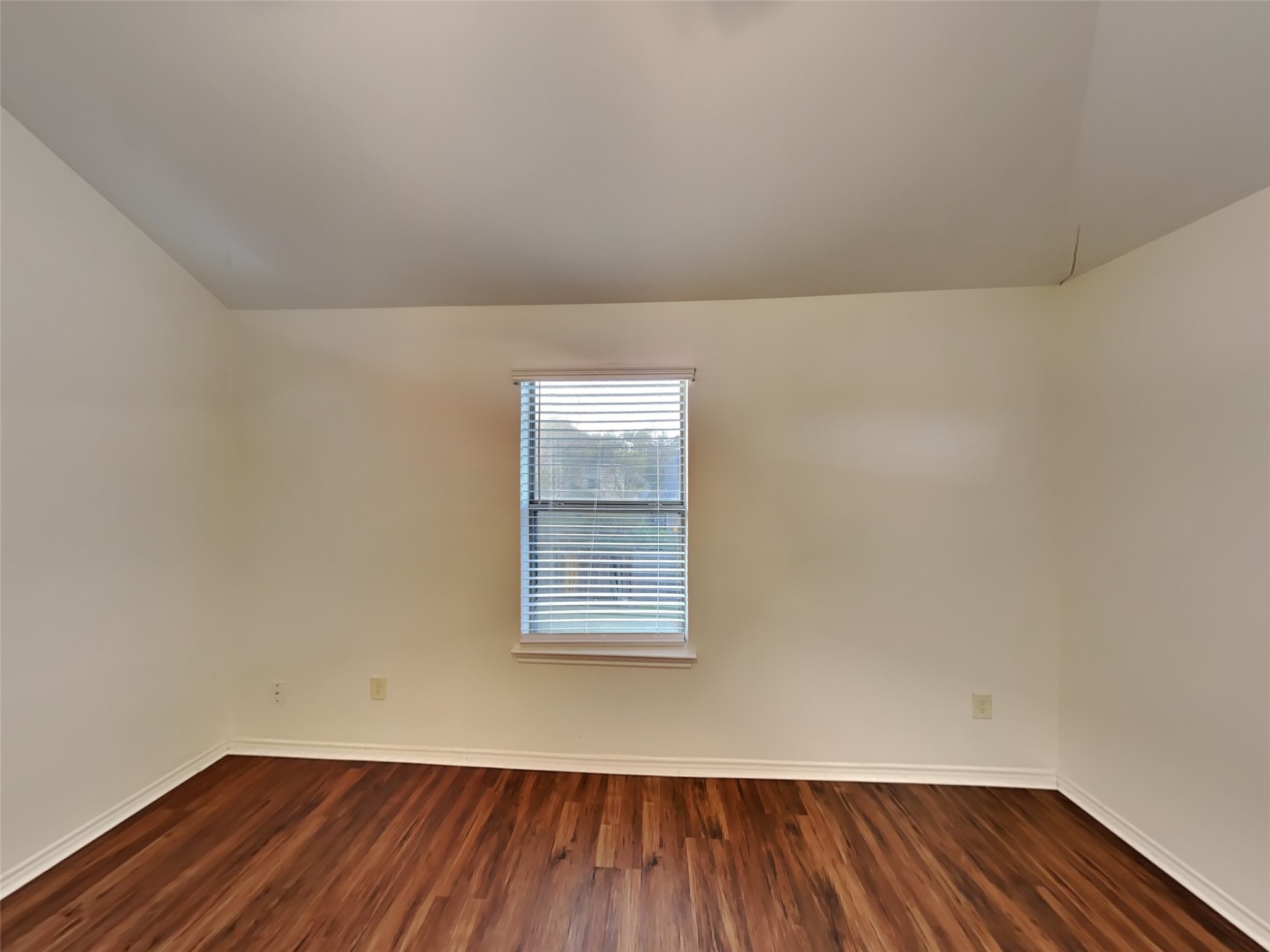 1323 Laura Hills Lane Spring, TX 77386 - Photo 13 of 22 a view of an empty room with wooden floor and a window