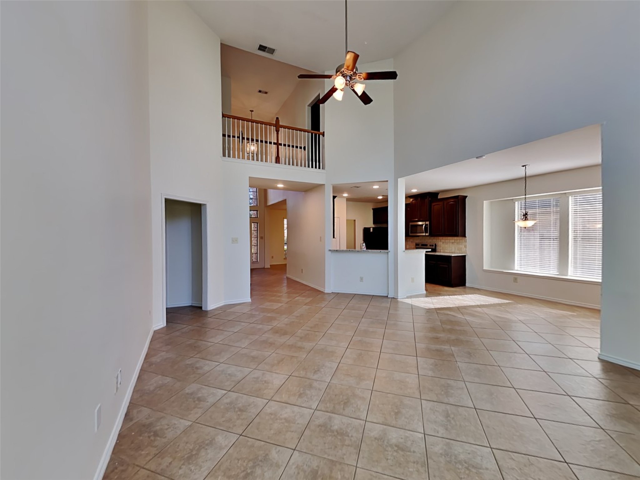 1323 Laura Hills Lane Spring, TX 77386 - Photo 4 of 22 a view of a livingroom with a kitchen