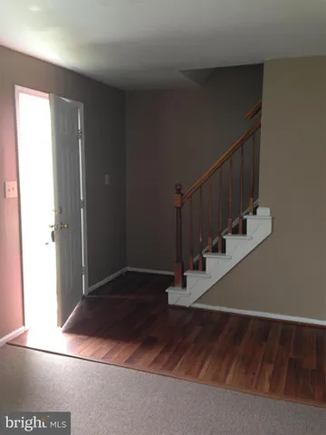 a view of entryway with wooden floor