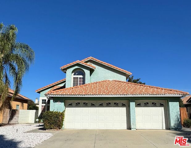 a front view of a house with a garage
