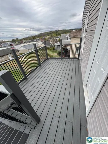 a view of balcony with wooden floor