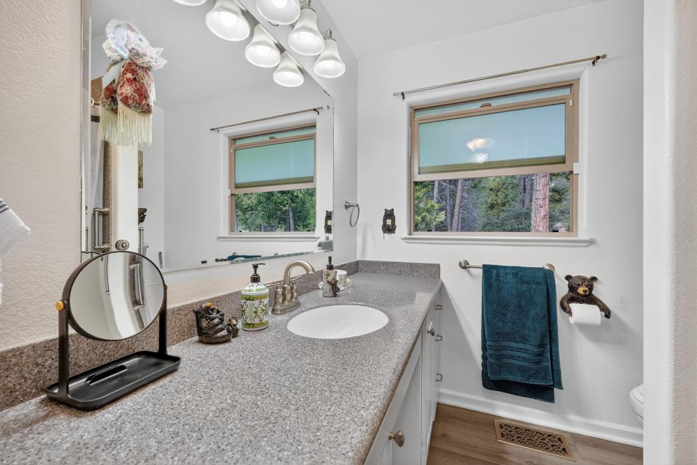 2026 Lily Valley Way West Point, CA 95255 - Photo 29 of 39 a bathroom with a double vanity sink and a mirror