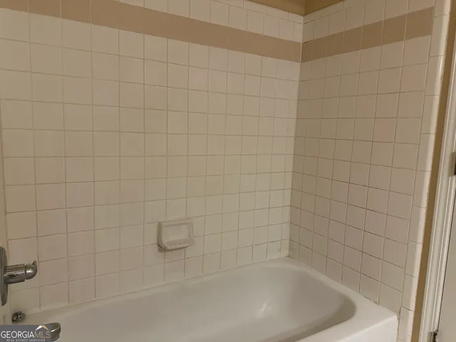 a close up of a bathtub in a bathroom