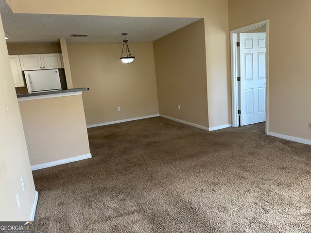 a view of a storage & utility room with a sink
