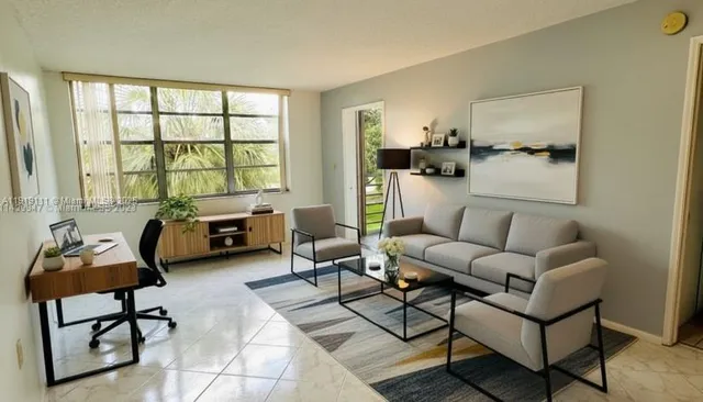 a living room with furniture and a large window