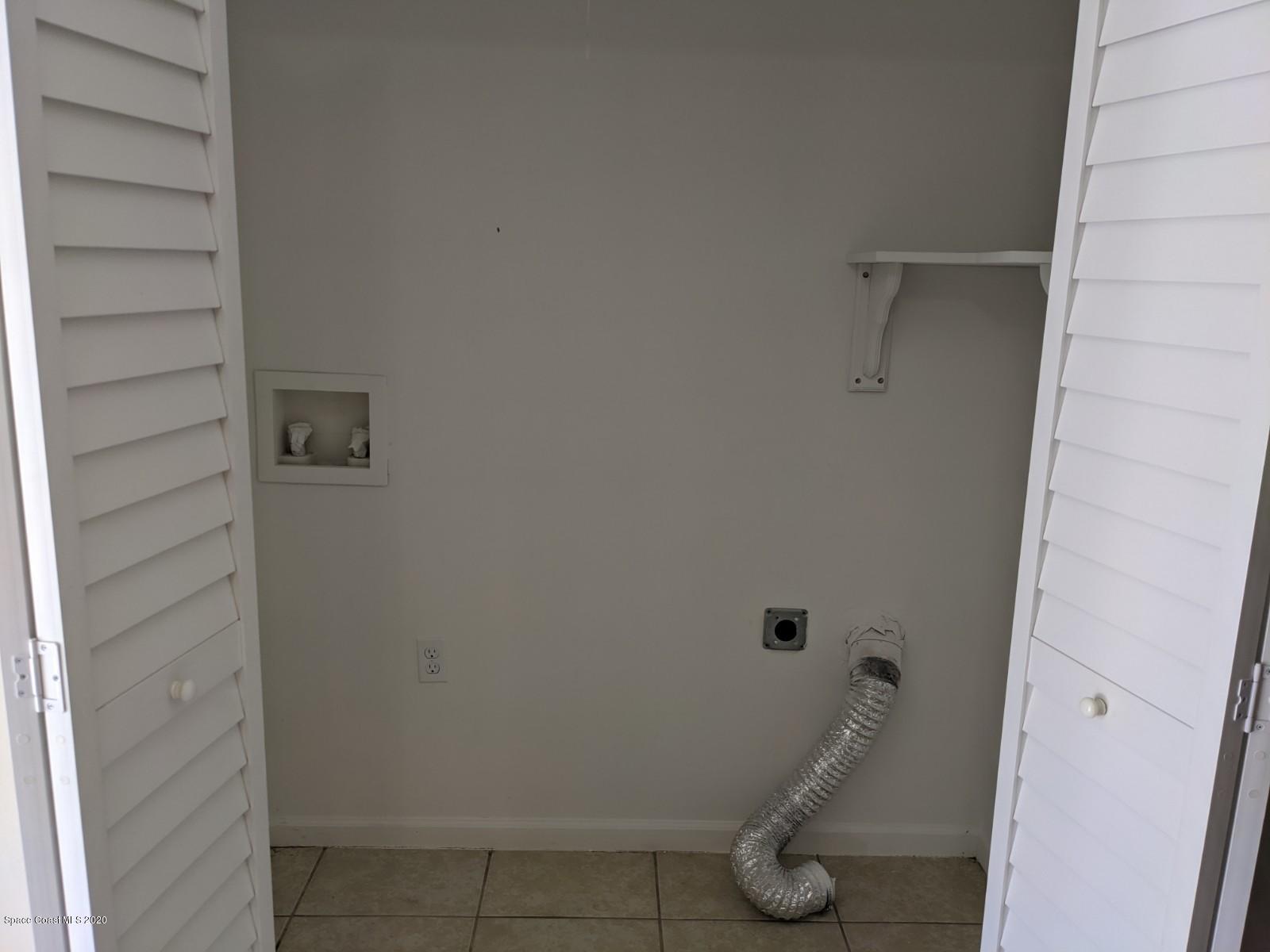 526 Rheine Road Northwest Palm Bay, FL 32907 - Photo 5 of 24 laundry in kitchen