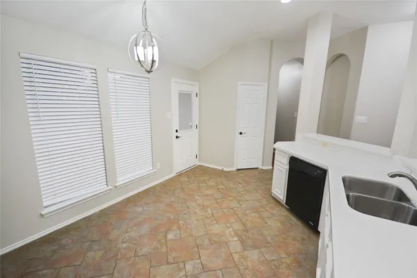 a view of a kitchen with a sink and dishwasher kitchen view