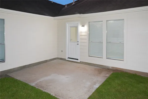 a view of an empty room with windows
