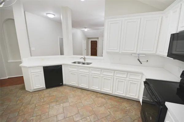 a spacious bathroom with a double vanity sink mirror and
