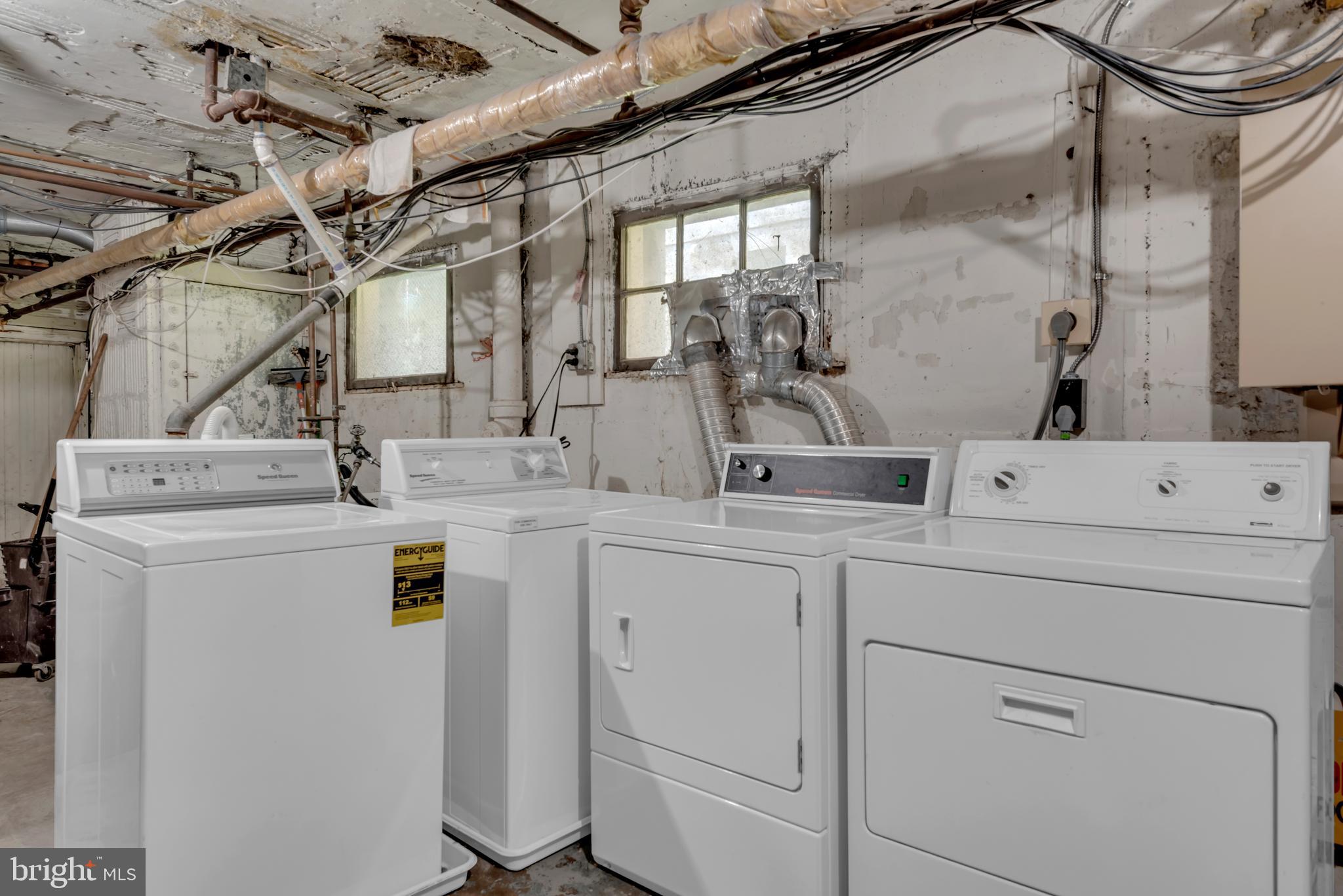 3020 Porter Street Northwest, Unit 103 Washington, DC 20008 - Photo 27 of 30 a utility room with dryer and washer