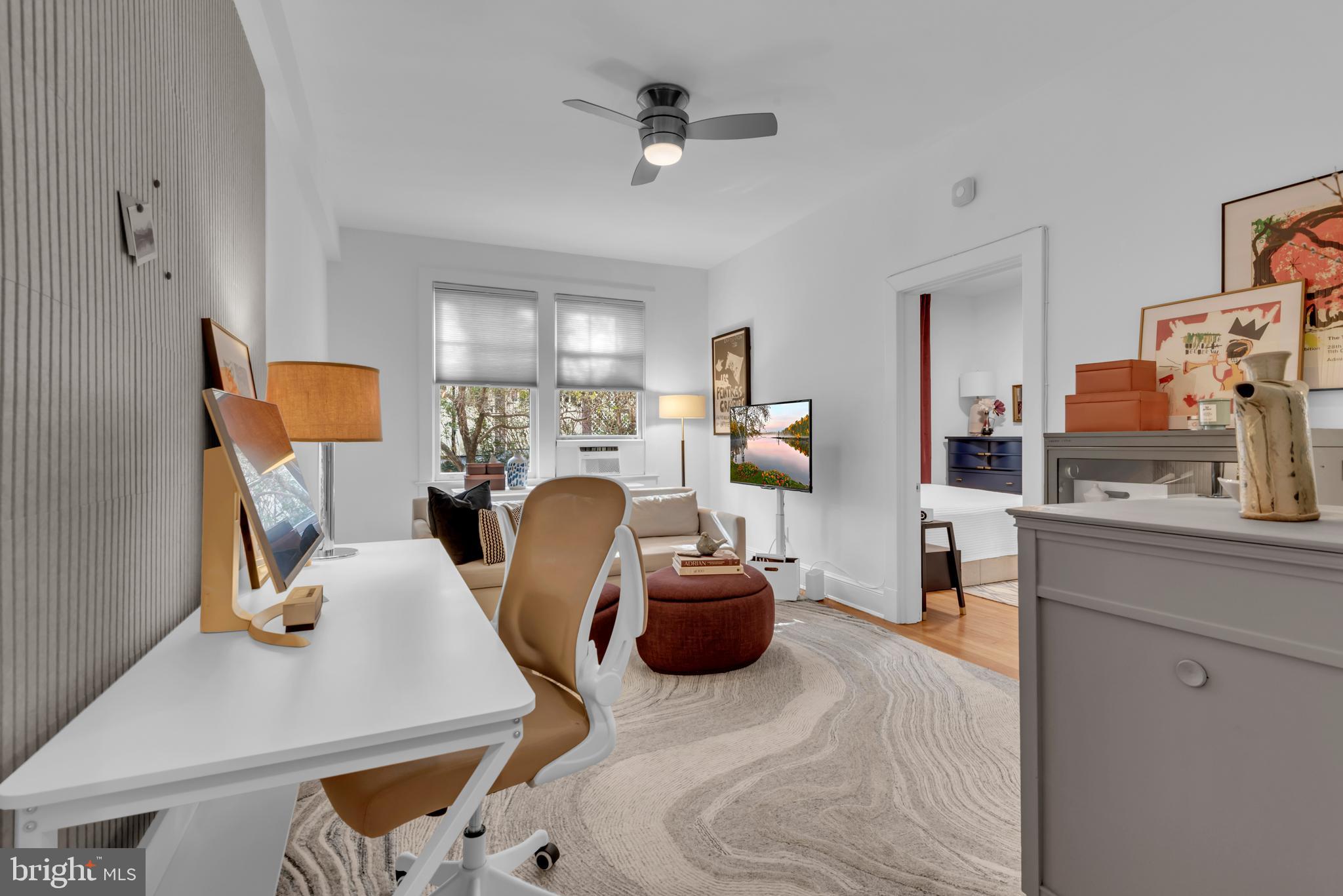 3020 Porter Street Northwest, Unit 103 Washington, DC 20008 - Photo 7 of 30 a living room with furniture and a window