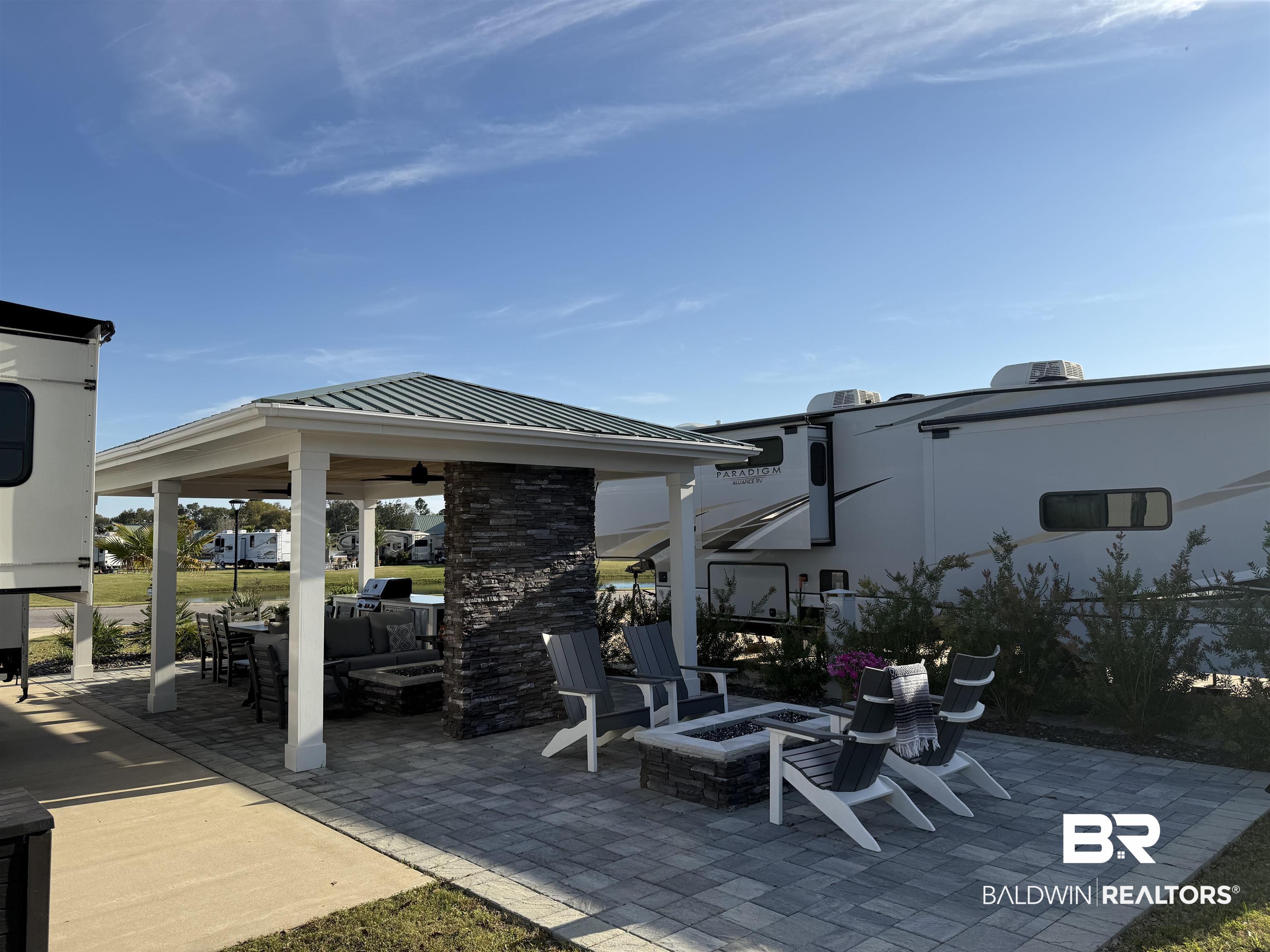 12377 Gateway Drive Elberta, AL 36530 - Photo 21 of 64 View of patio / terrace with a fire pit and a ceiling fan