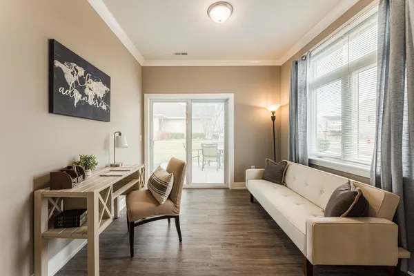 a living room with furniture and a large window