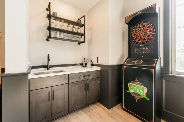 a kitchen with a sink and a stove top oven