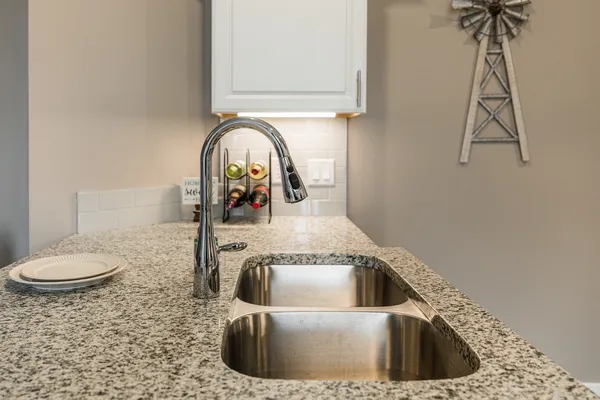 a close view of a sink and tap