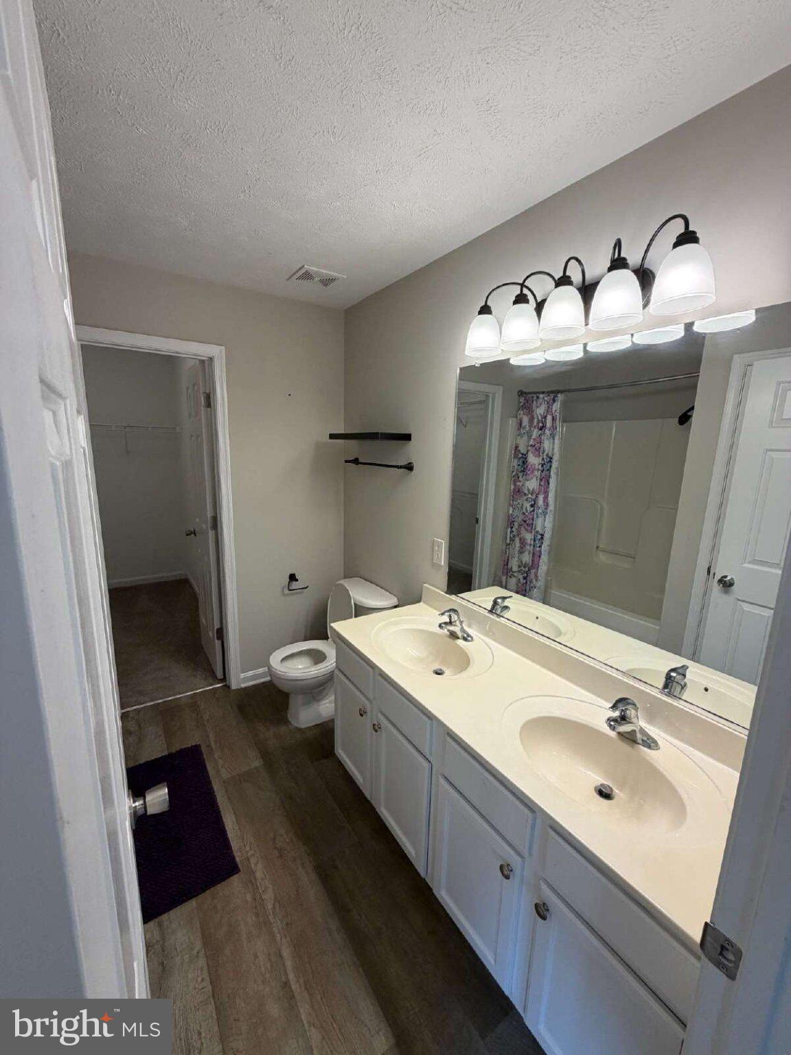 313 3rd Street Colonial Beach, VA 22443 - Photo 9 of 36 Spacious dual-sink bathroom retreat.