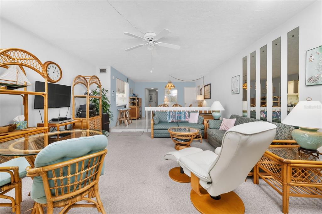 2955 North Beach Road, Unit B614 Englewood, FL 34223 - Photo 15 of 67 a living room with furniture kitchen view and a large window