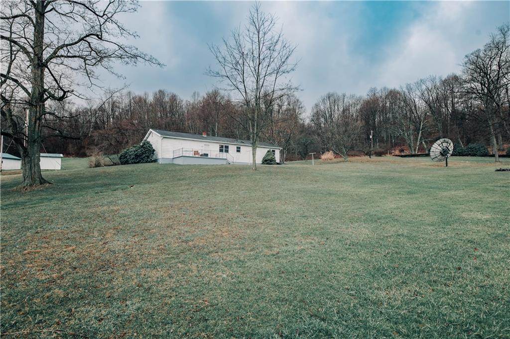 246 King Hill Road Indiana, PA 15701 - Photo 20 of 24 a backyard of a house with table and chairs
