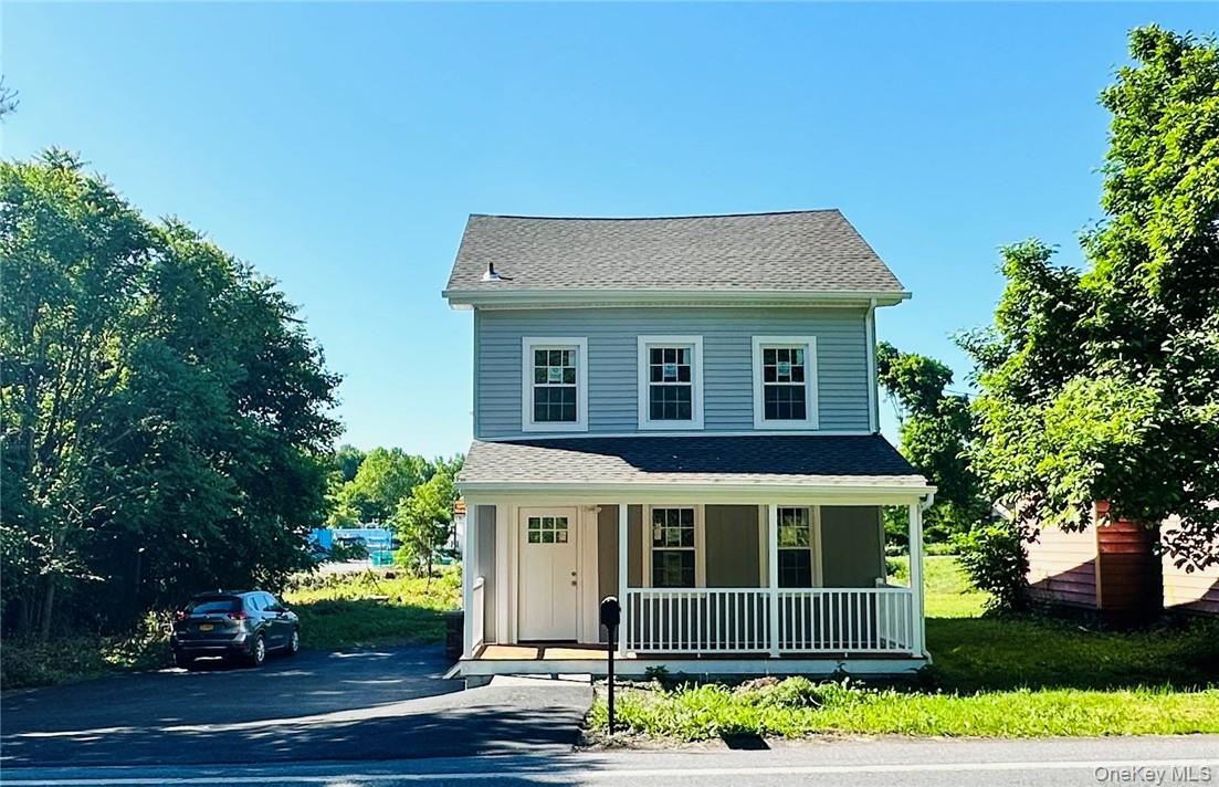 32 Salt Point Turnpike Poughkeepsie, NY 12601 - Photo 1 of 1 a front view of a house with a garden