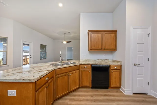 a kitchen with a sink and a refrigerator