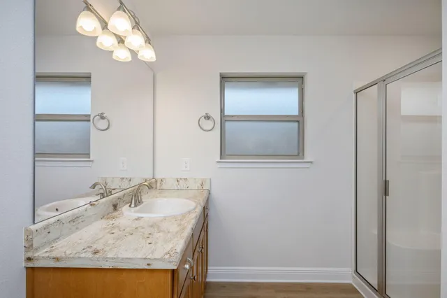 a bathroom with a sink and a mirror