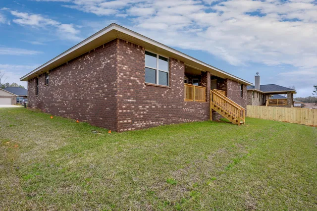 a backyard of a house with lots of green space
