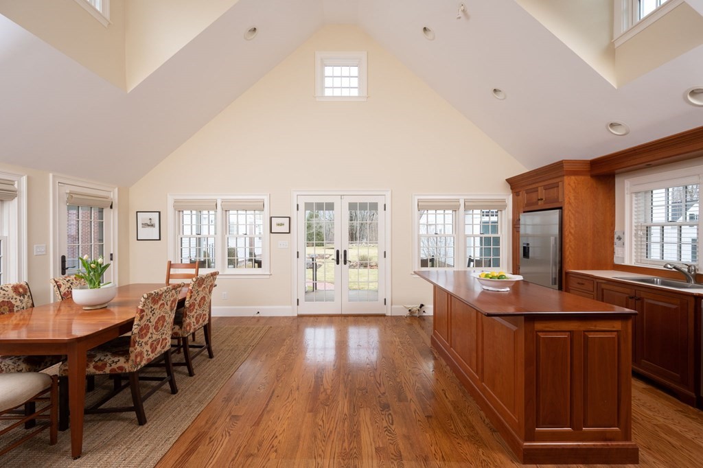 40 Spring Street Hingham, MA 02043 - Photo 11 of 27 a view of a dining room with furniture and wooden floor