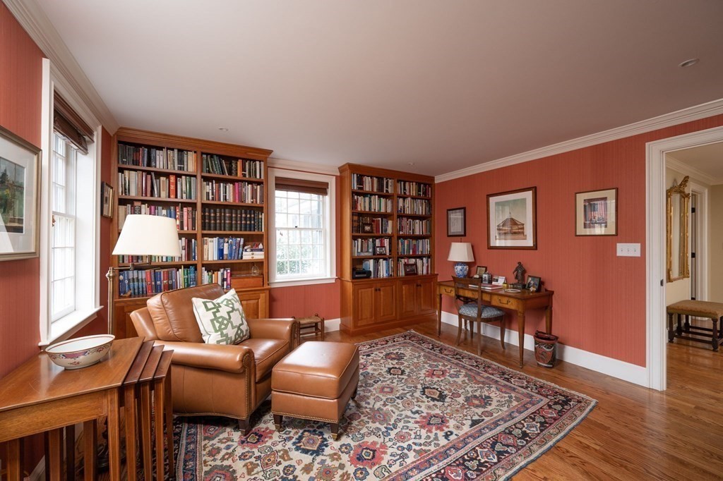 40 Spring Street Hingham, MA 02043 - Photo 16 of 27 a living room with furniture and a book shelf