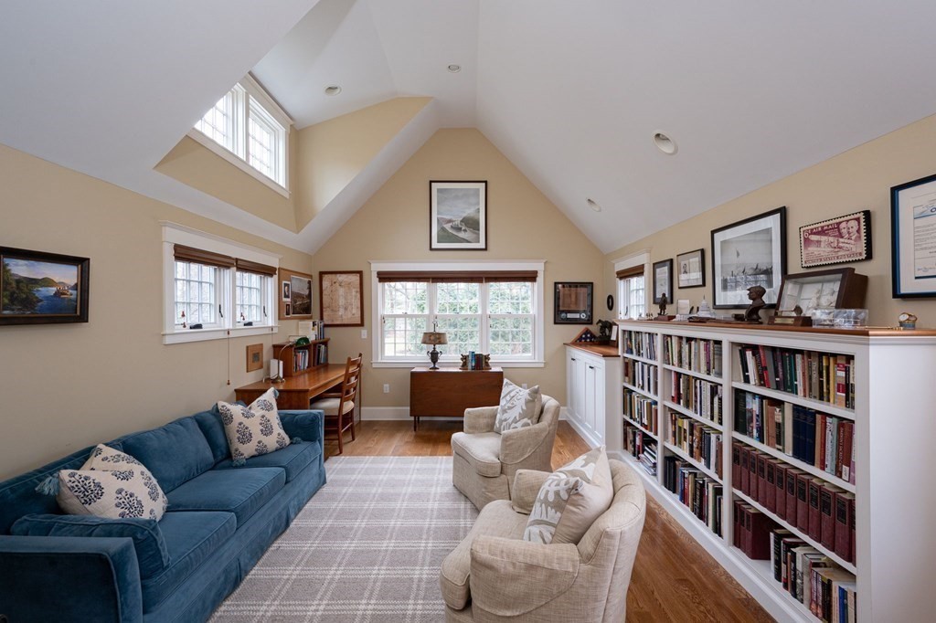 40 Spring Street Hingham, MA 02043 - Photo 24 of 27 a living room with furniture and a book shelf