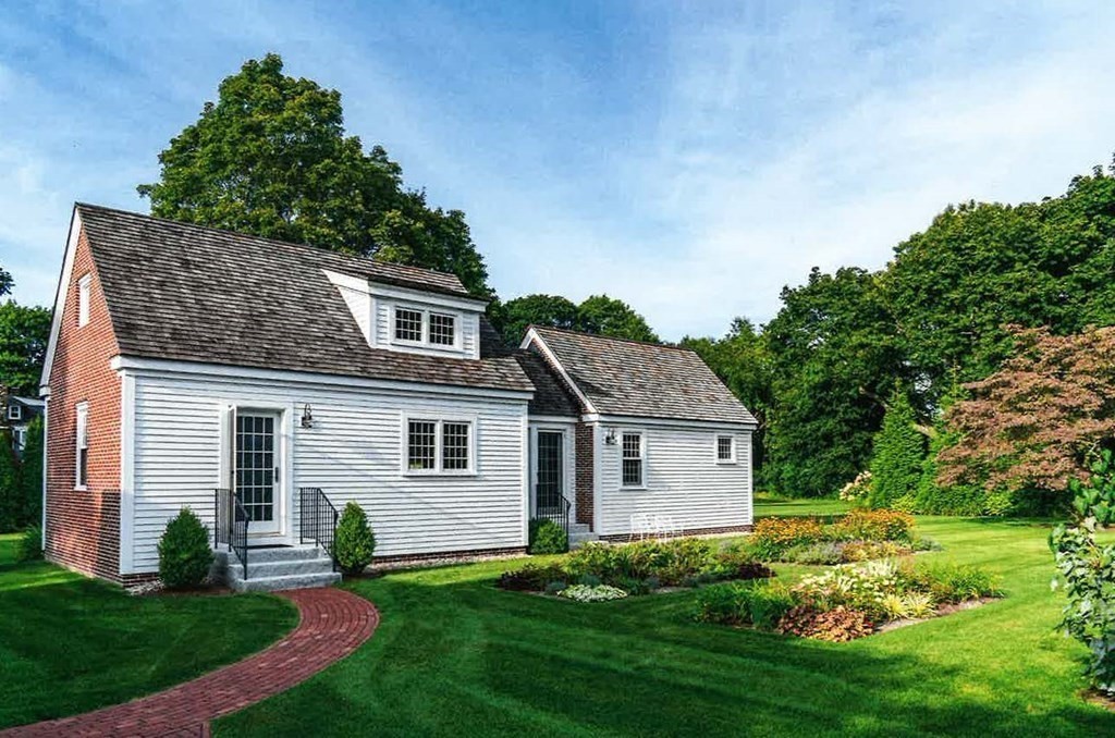40 Spring Street Hingham, MA 02043 - Photo 7 of 27 a front view of a house with a yard