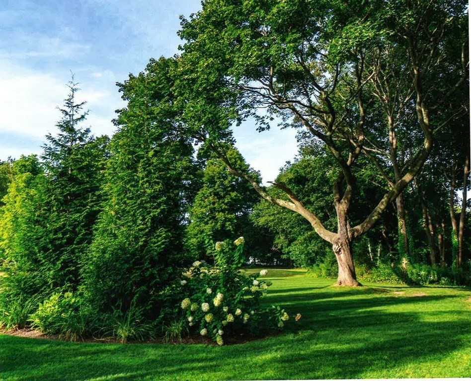 40 Spring Street Hingham, MA 02043 - Photo 8 of 27 a front view of a house with a garden