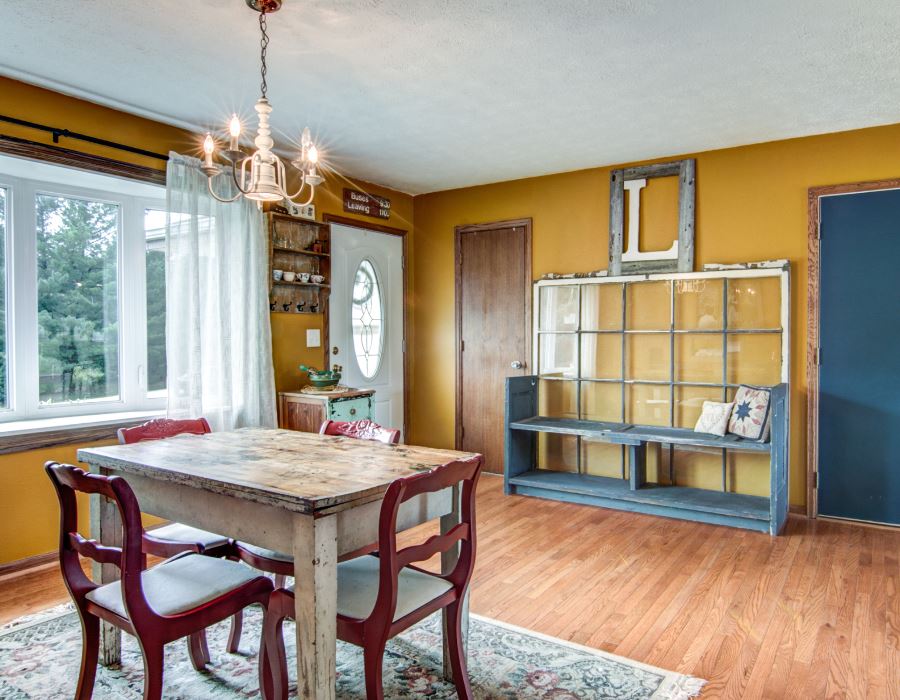 11725 Bend River Road Roscoe, IL 61073 - Photo 4 of 24 a dining room with a wooden table and chairs