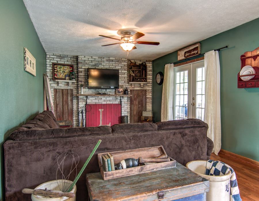 11725 Bend River Road Roscoe, IL 61073 - Photo 7 of 24 a living room with fireplace furniture and a flat screen tv