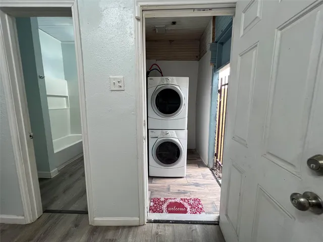 a close view of a utility room with dryer and washer