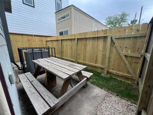 a view of a patio with chairs and a table
