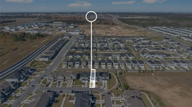 an aerial view of a city with ocean view