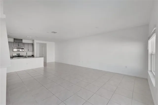 a view of kitchen and refrigerator