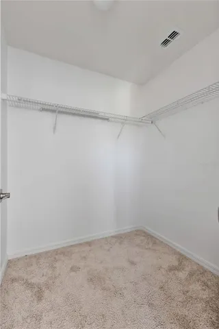 a view of an empty walk in closet