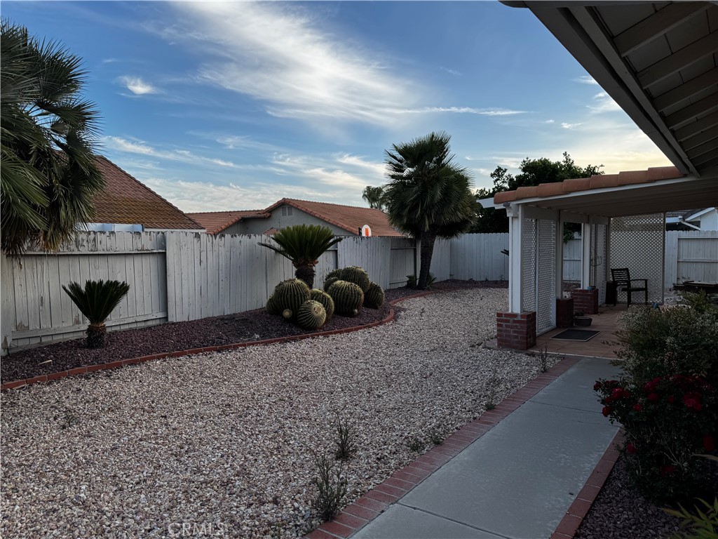 27519 Terrytown Road Menifee, CA 92586 - Photo 4 of 22 a view of a house with a patio