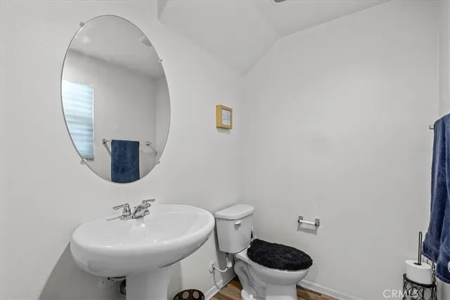 a bathroom with a sink toilet a mirror and shower