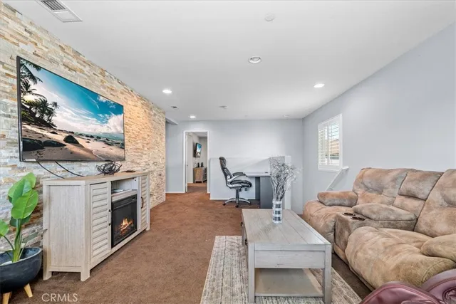 a bed room with a bed and a chair