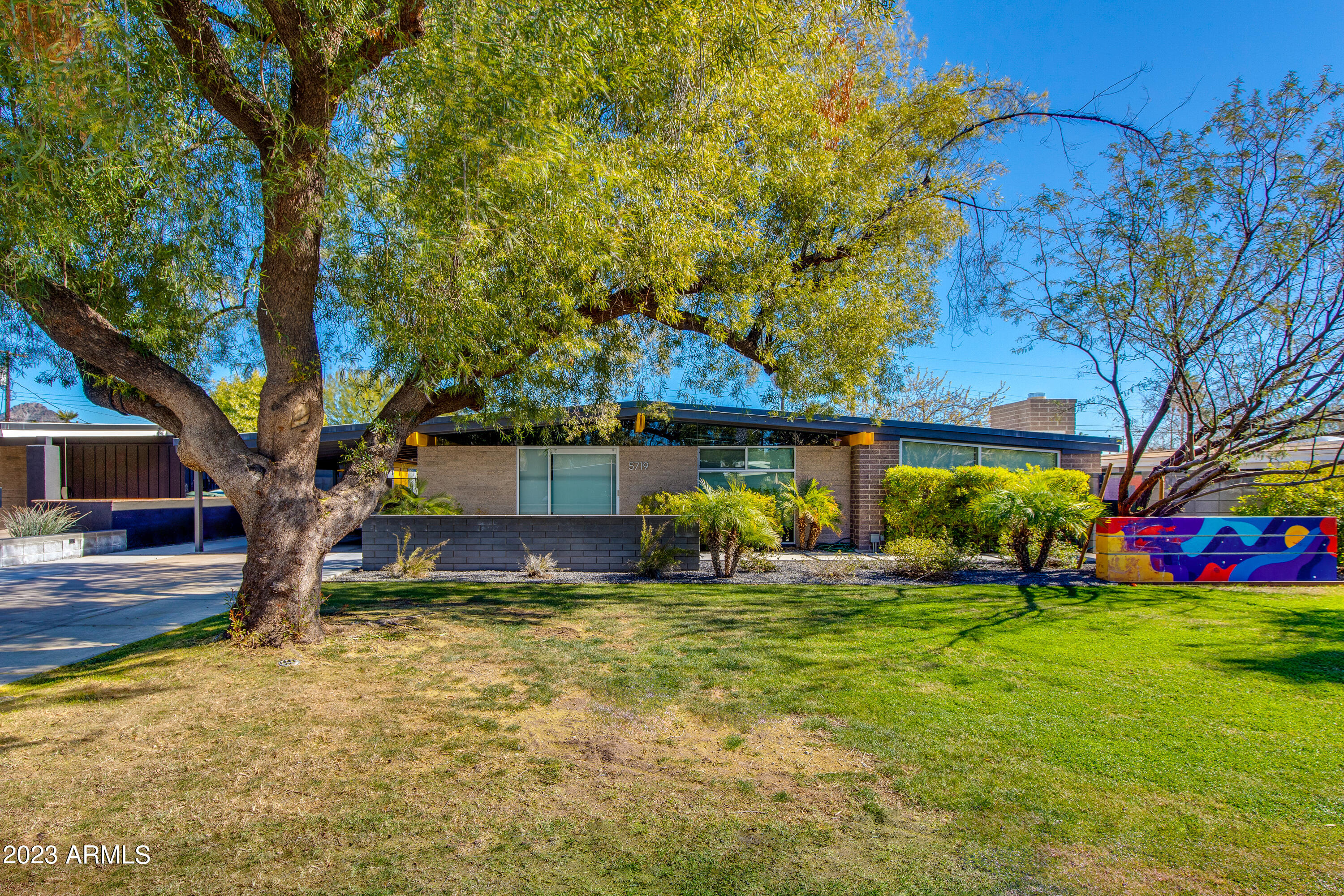 5719 North 11th Street Phoenix, AZ 85014 - Photo 1 of 18 a view of a house with a yard
