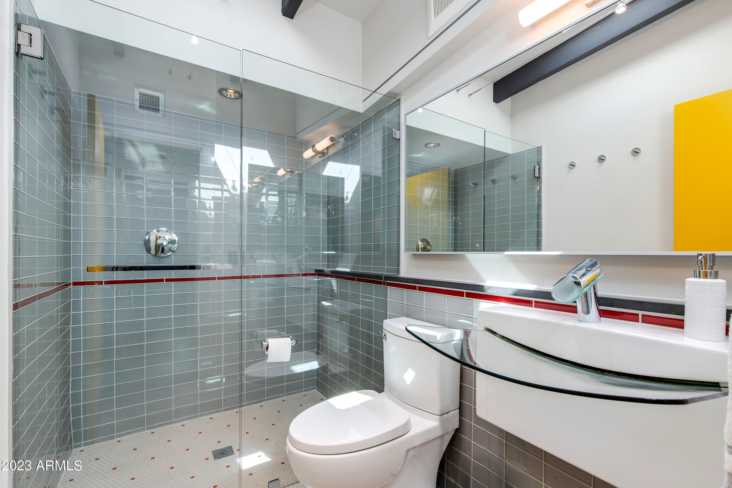 5719 North 11th Street Phoenix, AZ 85014 - Photo 14 of 18 a bathroom with a sink a toilet and shower